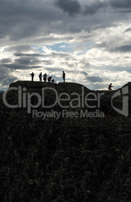 People on the top of the rocks