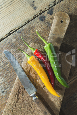 Hot peppers on wooden cutting board