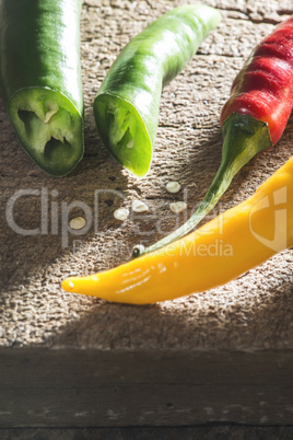 Hot peppers on wooden cutting board