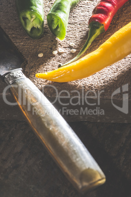 Hot peppers on wooden cutting board