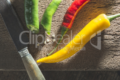 Hot peppers on wooden cutting board