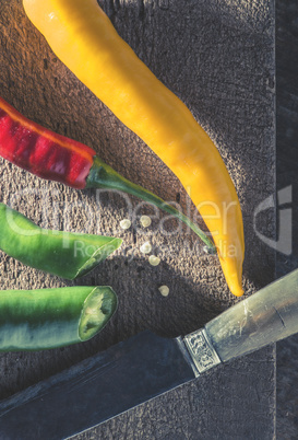 Hot peppers on wooden cutting board