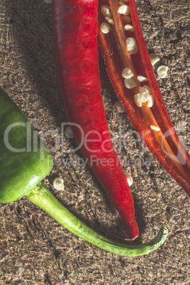 Red hot peppers on wooden  cutting board