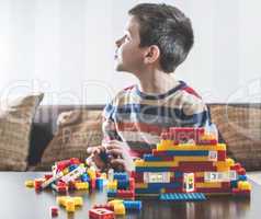 Child play with children's constructor toys