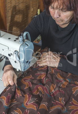 Woman and sewing machine