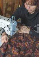 Woman and sewing machine