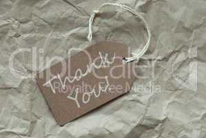Beige Label With Thank You Paper Background