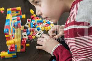 Child play with children's constructor toys