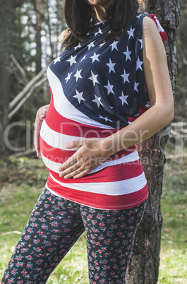 Pregnant woman in the forest