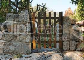 Small wooden wicket or gate of Mediterranean house