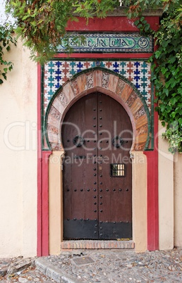 Moorish style door of a house in Granada, Spain