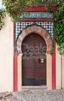 Moorish style door of a house in Granada, Spain