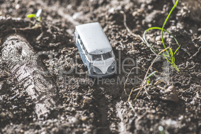 Vintage bus VW. Small metal toy in the nature