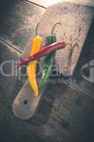 Hot peppers on wooden cutting board