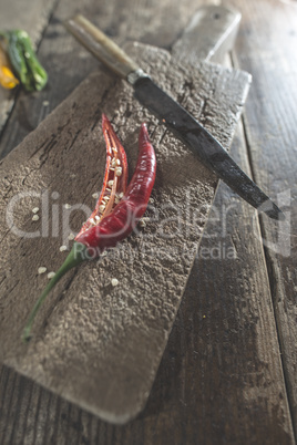 Hot peppers on wooden cutting board