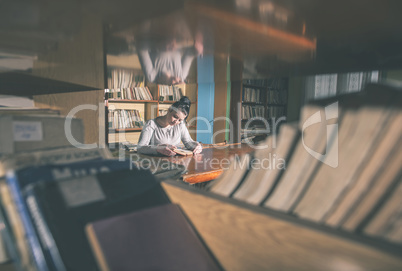 Young women in a vintage library