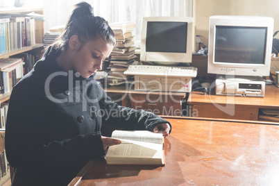 Young women in a vintage library