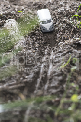 Vintage bus VW. Small metal toy in the nature