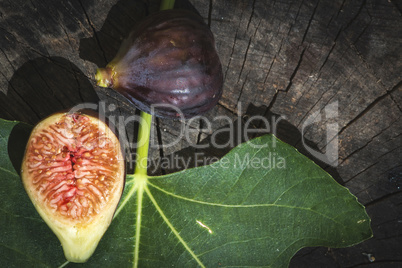 Figs and leaves on wood