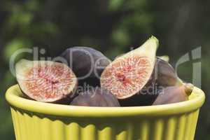 Figs in bowl on wood