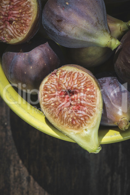 Figs in bowl on wood