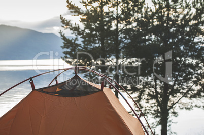 Tent in front of mountain dam
