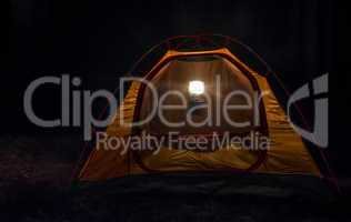 Tent in the forest at night