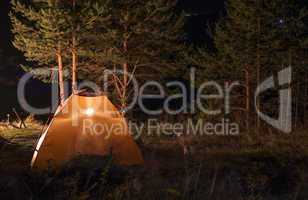 Tent in the forest at night
