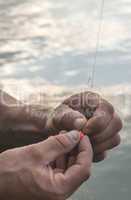 Man prepare rod for fishing