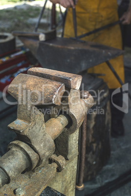 Vise and anvil in a forge shop