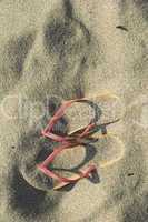 Sandals on the beach in the sand