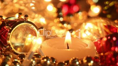 candle and holiday lights close-up seamless loop
