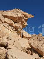Scenic weathered yellow rock in stone desert, Israel