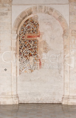 Semicircular niche with fresco remains in medieval castle church in Milazzo, Sicily