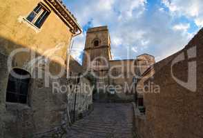 Fisheye view of medieval street in village of Savoca in Sicily, Italy, at sunset