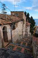 Small street in Sicilian town of Taormina descenging toward the sea