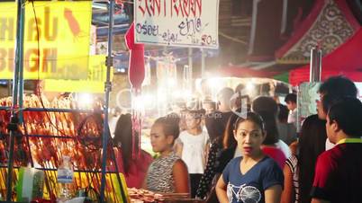 people walk in night asian market