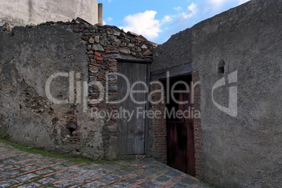 Door of the poor old house in Savoca village, Sicily, Italy