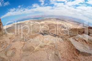 Fisheye view of desert landscape under Masada fortress near the Dead Sea