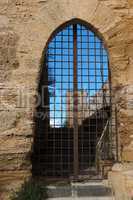 Barred gate off Castello di Lombardia medieval castle in Enna, Sicily, Italy