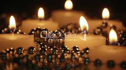 burning candles and beads in night seamless loop