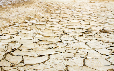 Photo of dry and cracked earth .