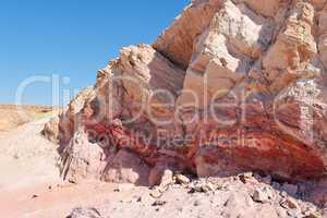 Striped pink rock in stone desert in Large Crater (Makhtesh Gadol) in Israel