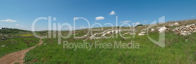 Hiking trail among Mediterranean landscape in spring