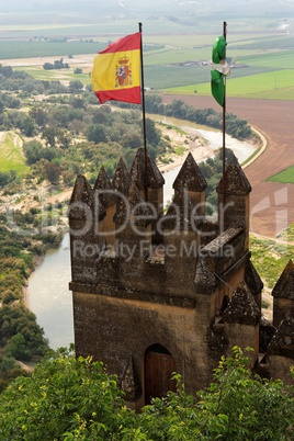 Almodovar Del Rio medieval castle with flags of Spain and Andalusia
