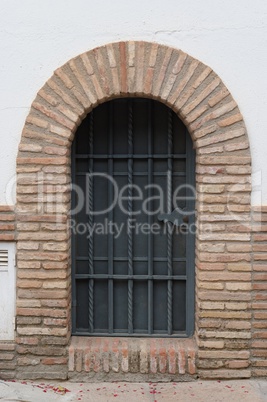 Large window or door with grate and metal mesh