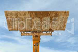 Bulldozer excavation scoop on sky background