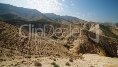 Valley between hills in desert in spring