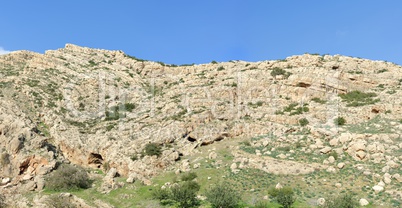 Texture of a layered sedimentary rock under the blue sky