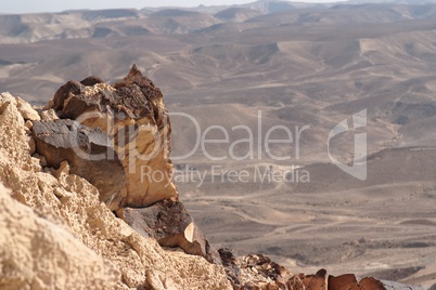 Jagged rock on the edge of the cliff in the desert